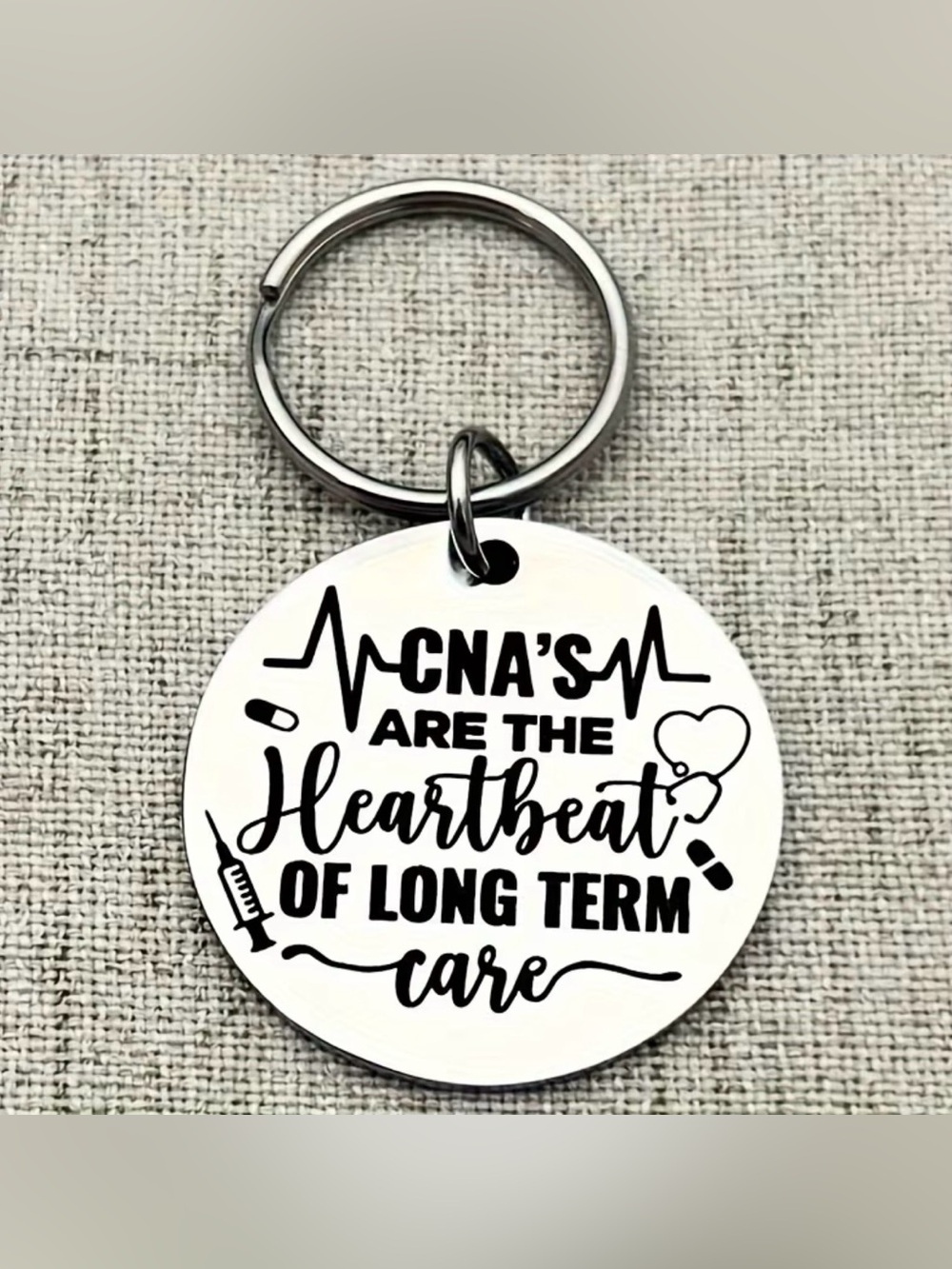 CNA Themed Round Metal Keychain - Silver with Black Text